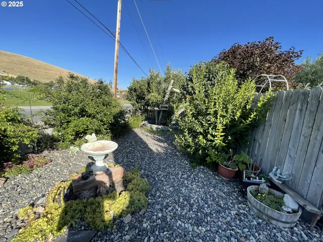 a view of a back yard and a patio