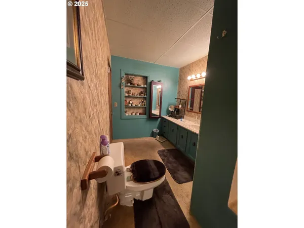 a living room with furniture and a mirror