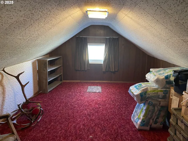 a bed room with a bed and a large mirror