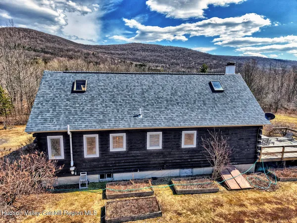 a view of an chairs and table in the balcony