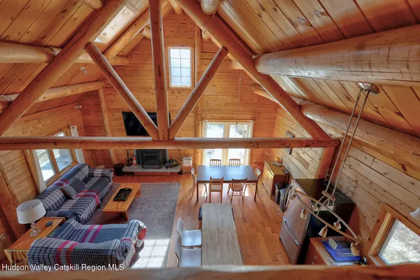 a kitchen with stainless steel appliances granite countertop a refrigerator a stove and a wooden floors