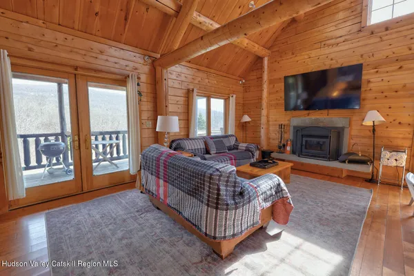 a bathroom with a granite countertop bathtub sink vanity mirror and toilet