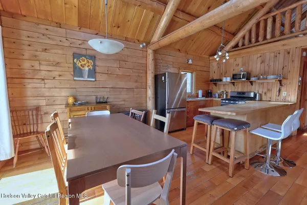 a bedroom with a bed and cabinet