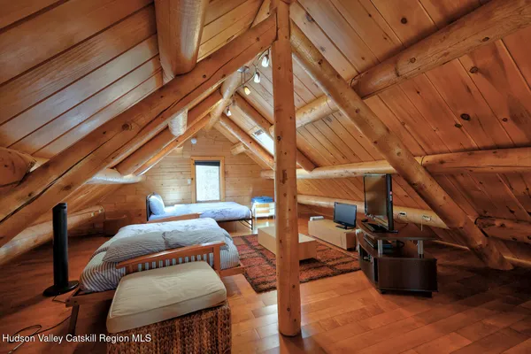 a bedroom with a bed and a desk