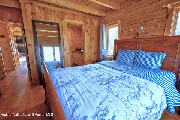 a wooden bench sitting in front of a house