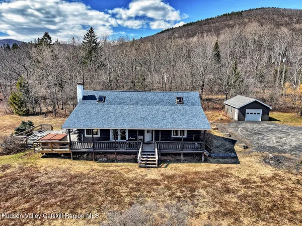 a roof view of a house with wooden deck