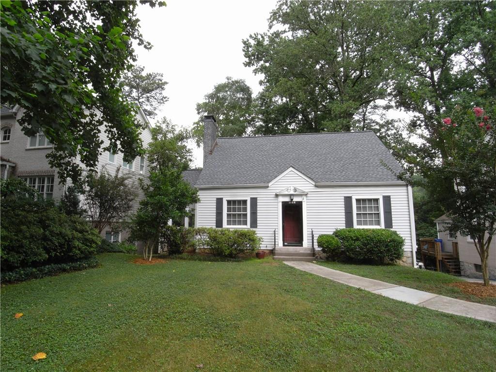 1086 Rosedale Road Northeast Atlanta, GA 30306 - Photo 1 of 1 a front view of a house with a garden
