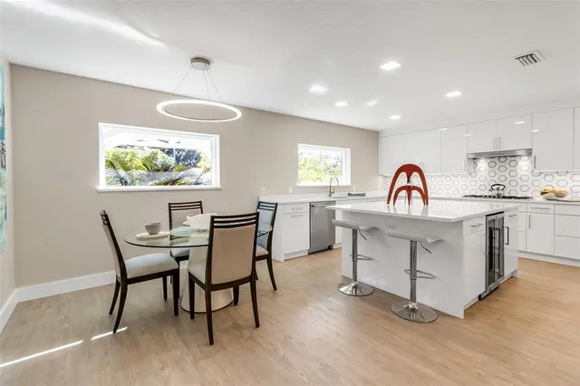 a kitchen with stainless steel appliances a stove and a refrigerator