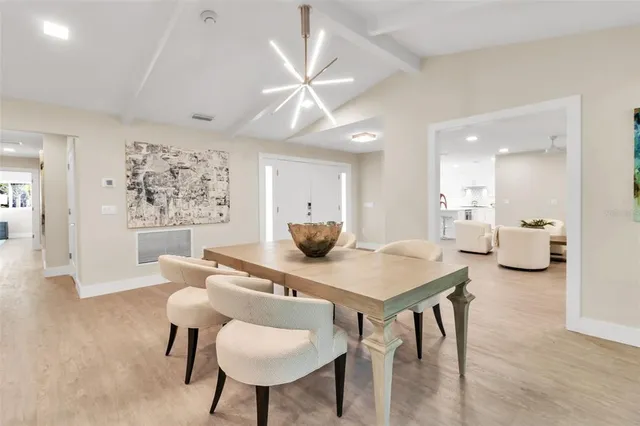 a living room with furniture a fireplace and a large window