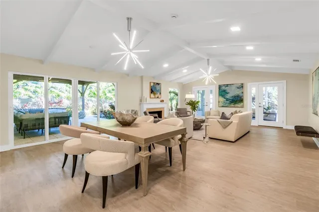 a living room with furniture a fireplace and a painting
