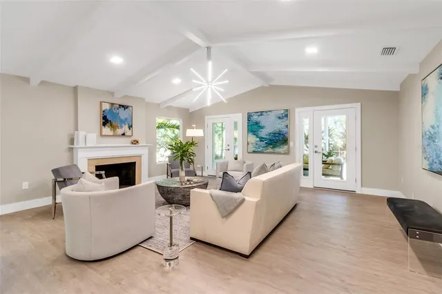 a spacious bedroom with a bed and a couch