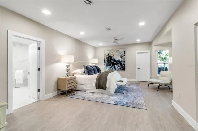 a bathroom with a double vanity sink mirror and shower