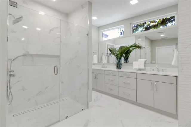 a bedroom with a large bed and a view of living room