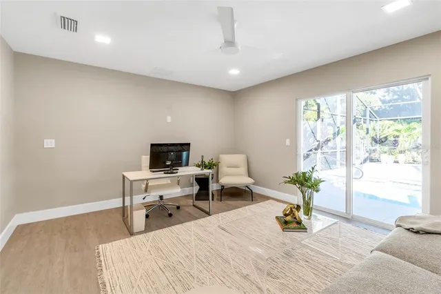 a view of washer and dryer with kitchen in the background