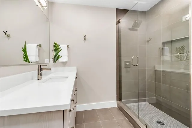 an aerial view of a house with yard