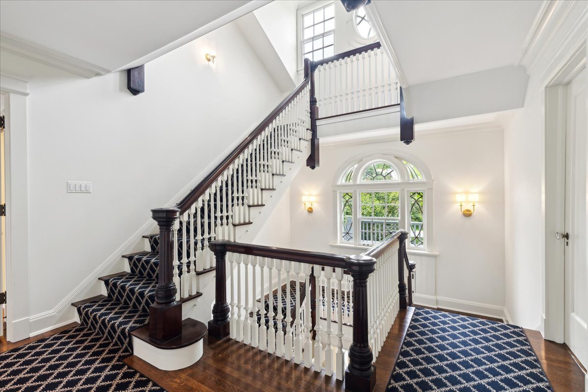 126 Hazel Avenue Glencoe, IL 60022 - Photo 18 of 44 a view of entryway with wooden floor and stairs