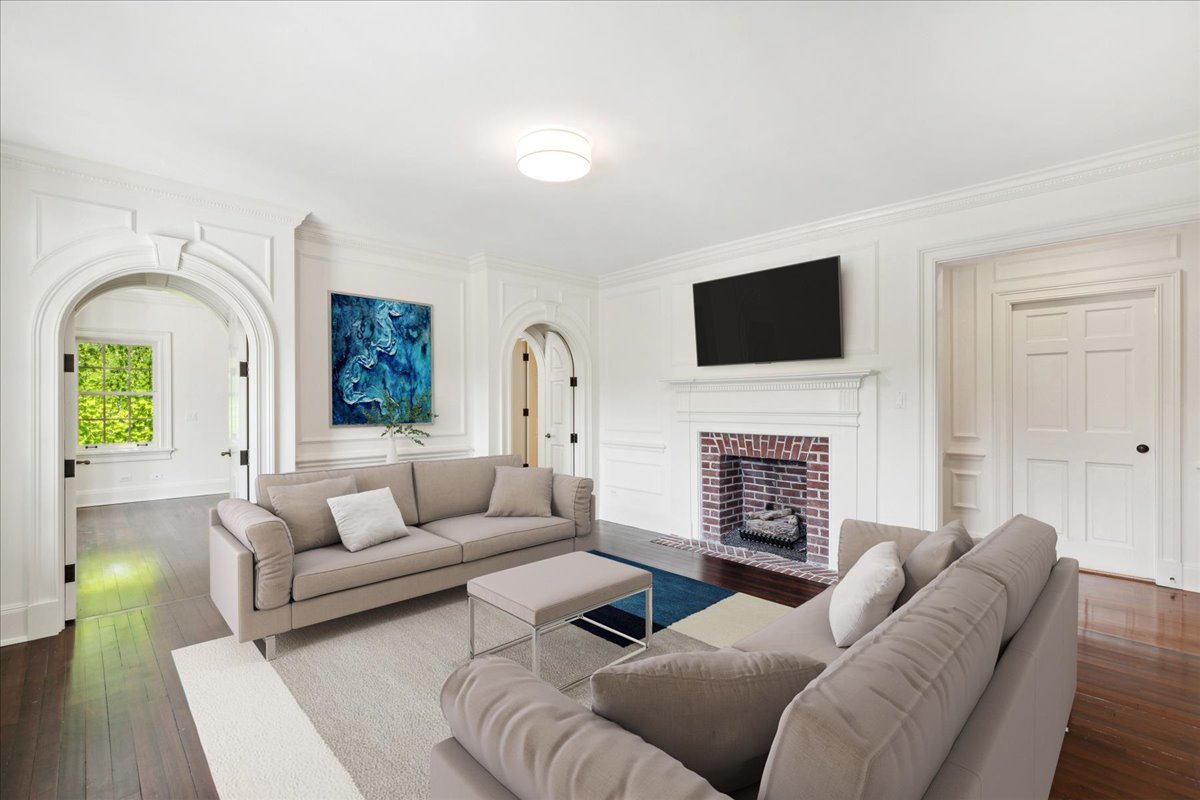 126 Hazel Avenue Glencoe, IL 60022 - Photo 19 of 44 a living room with furniture a fireplace and a flat screen tv