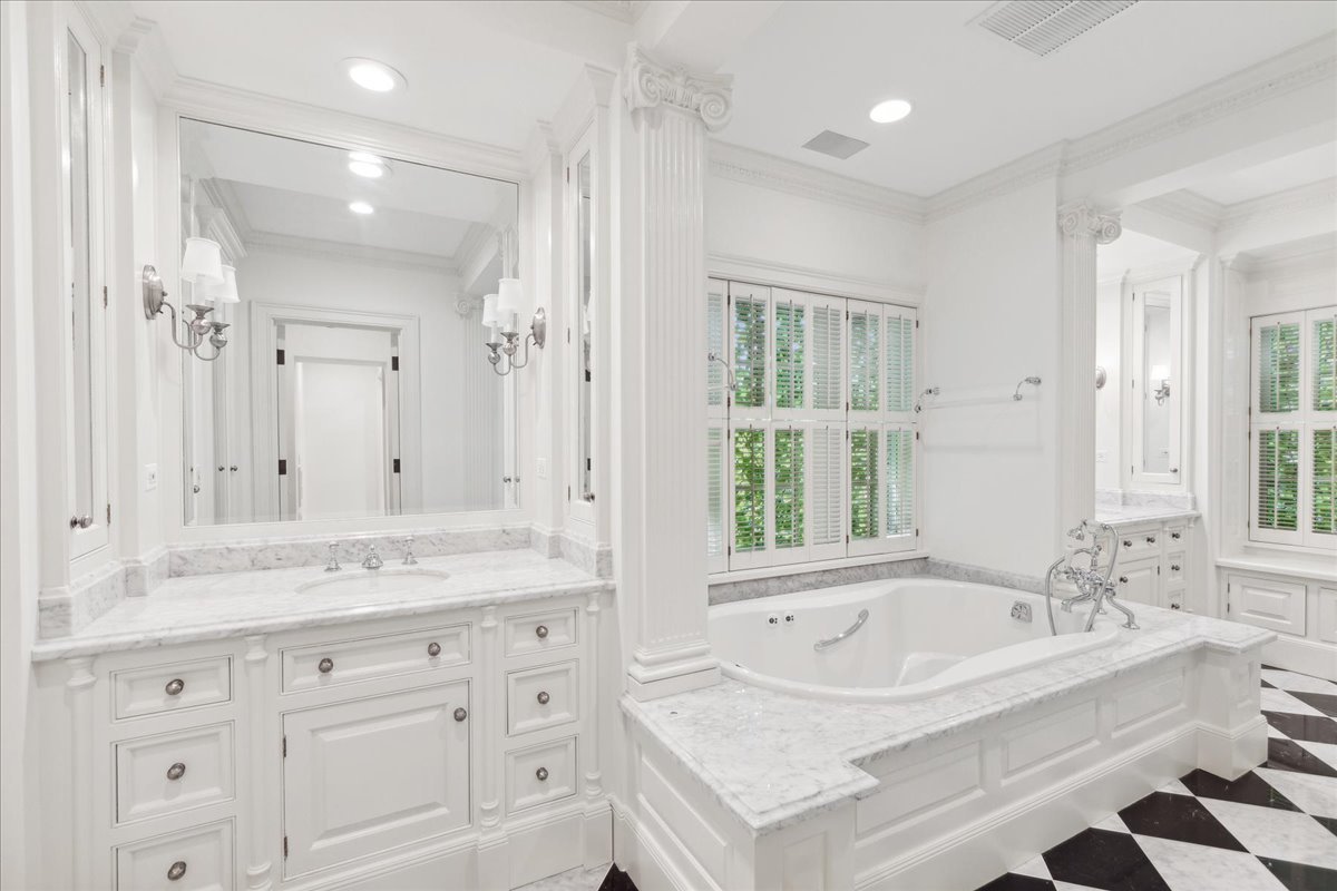 126 Hazel Avenue Glencoe, IL 60022 - Photo 21 of 44 a bathroom with a tub a sink and a window