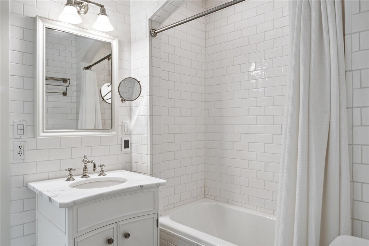 126 Hazel Avenue Glencoe, IL 60022 - Photo 23 of 44 a bathroom with a sink a toilet and shower