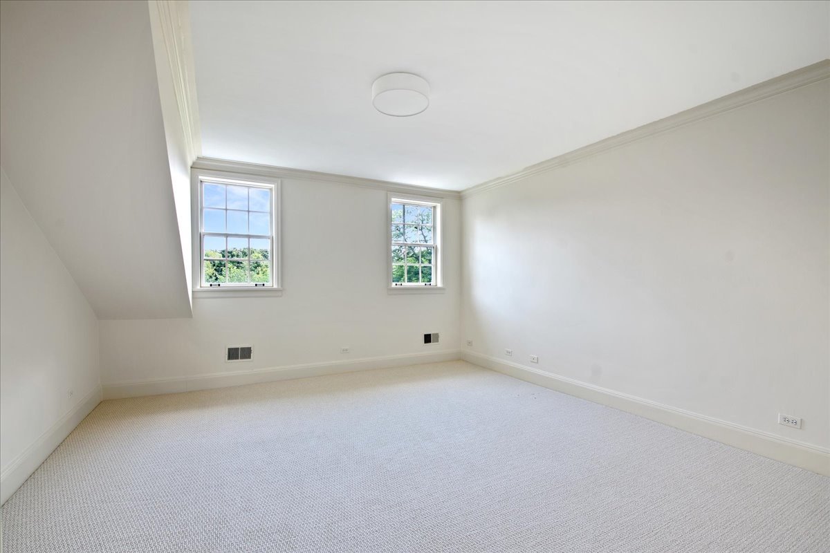 126 Hazel Avenue Glencoe, IL 60022 - Photo 27 of 44 an empty room with windows