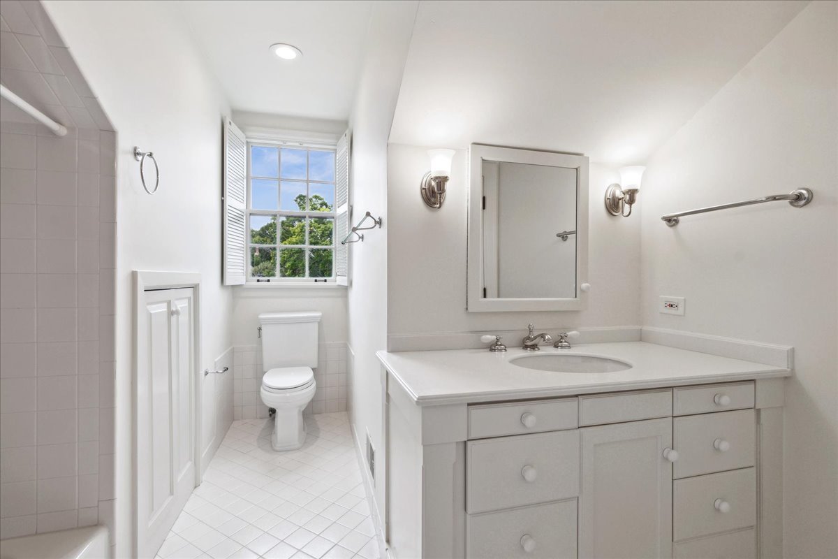 126 Hazel Avenue Glencoe, IL 60022 - Photo 28 of 44 a bathroom with a sink a toilet and shower