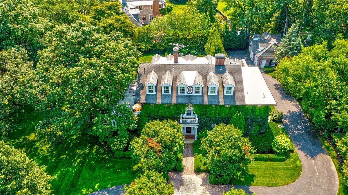 126 Hazel Avenue Glencoe, IL 60022 - Photo 3 of 44 a view of a house with a garden and plants