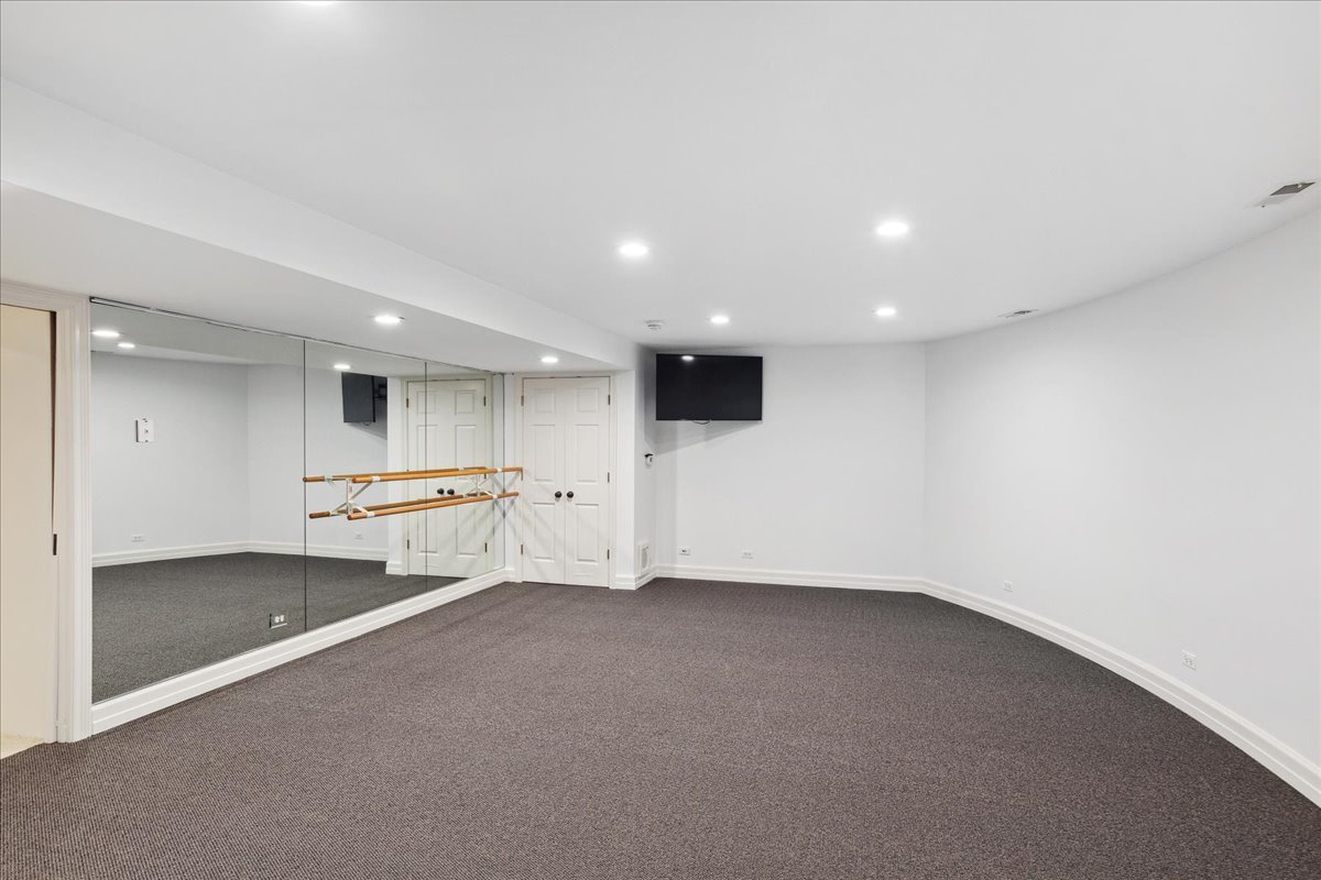 126 Hazel Avenue Glencoe, IL 60022 - Photo 32 of 44 an empty room with kitchen and stainless steel appliances