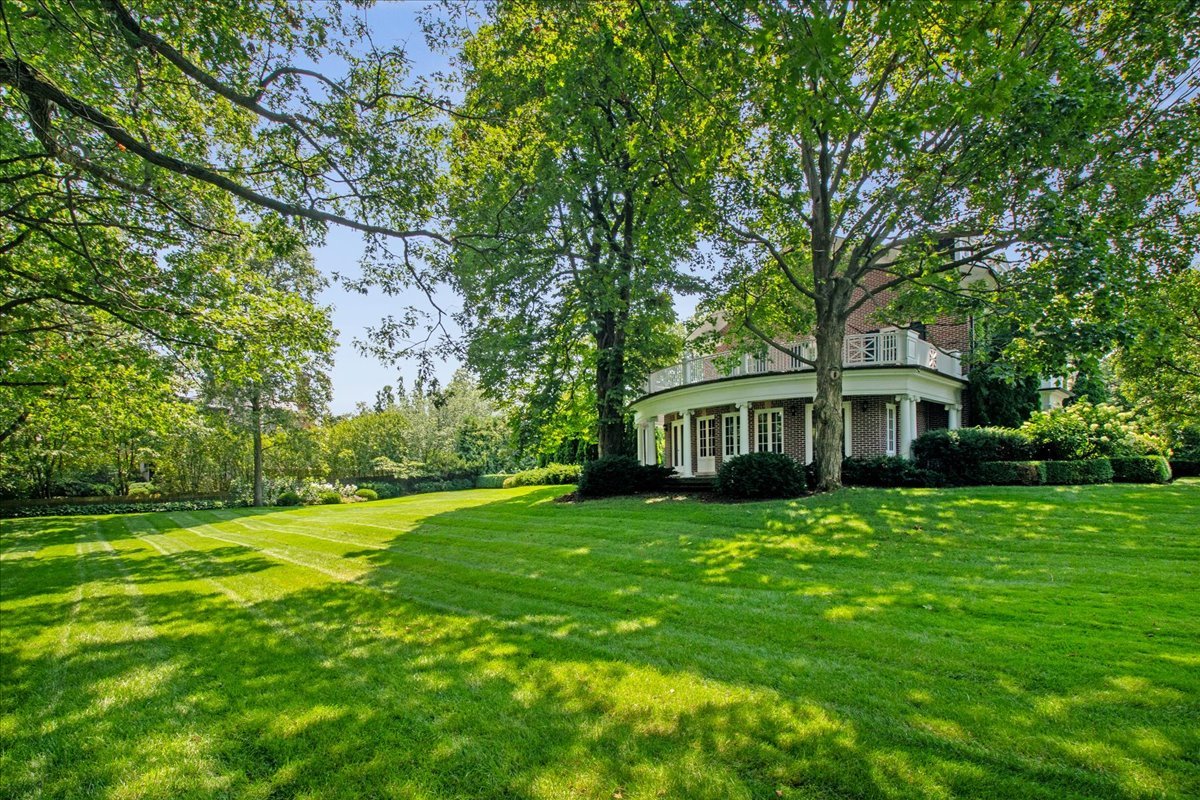 126 Hazel Avenue Glencoe, IL 60022 - Photo 33 of 44 a front view of a house with a garden