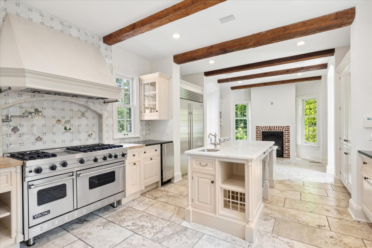 126 Hazel Avenue Glencoe, IL 60022 - Photo 9 of 44 a open kitchen with a stove top oven and cabinets