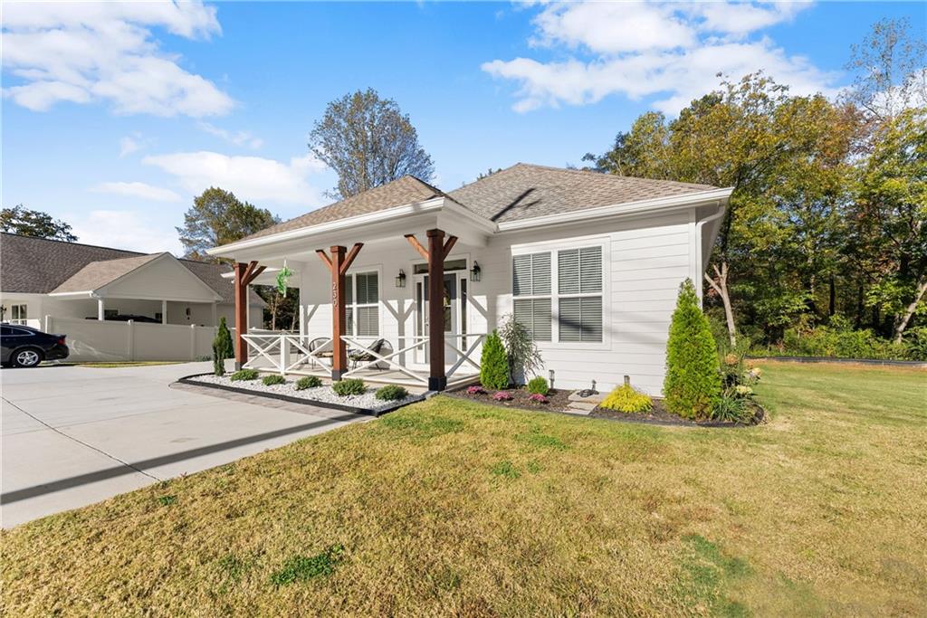 230 Campbell Street Cleveland, GA 30528 - Photo 2 of 37 a view of a house with backyard porch and sitting area