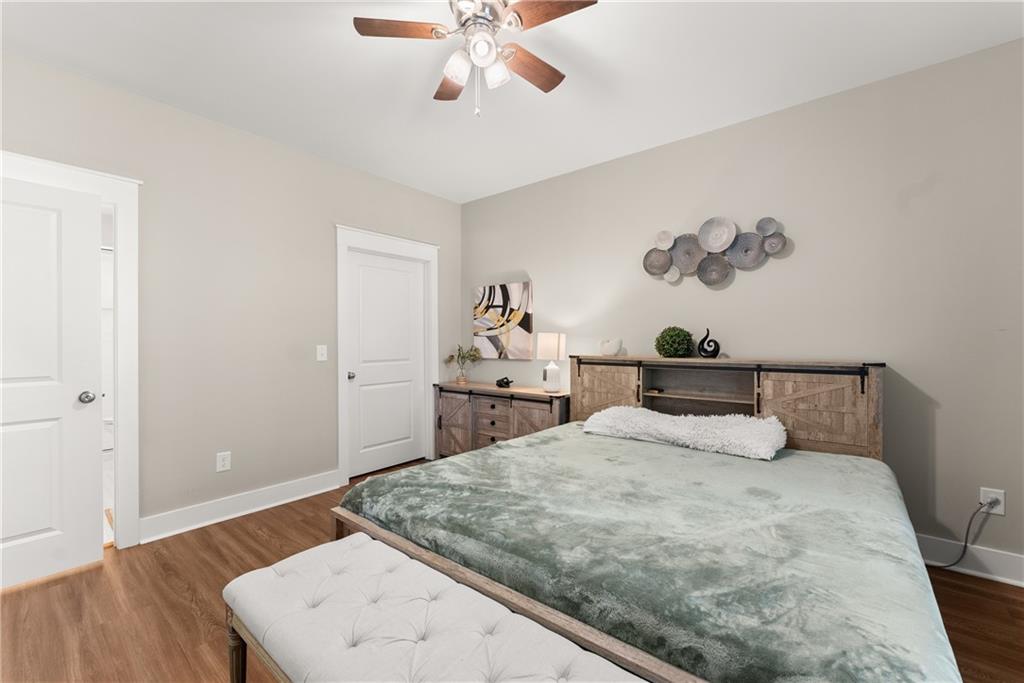 230 Campbell Street Cleveland, GA 30528 - Photo 23 of 37 a bedroom with a bed and wooden floor