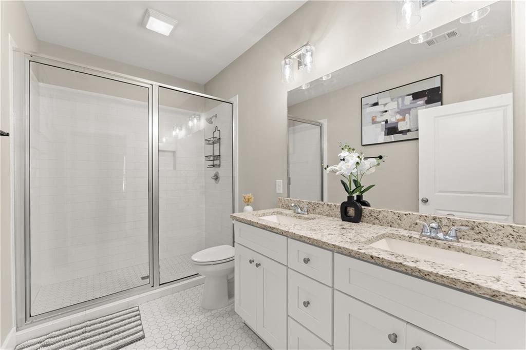 230 Campbell Street Cleveland, GA 30528 - Photo 25 of 37 a bathroom with a granite countertop sink toilet and shower