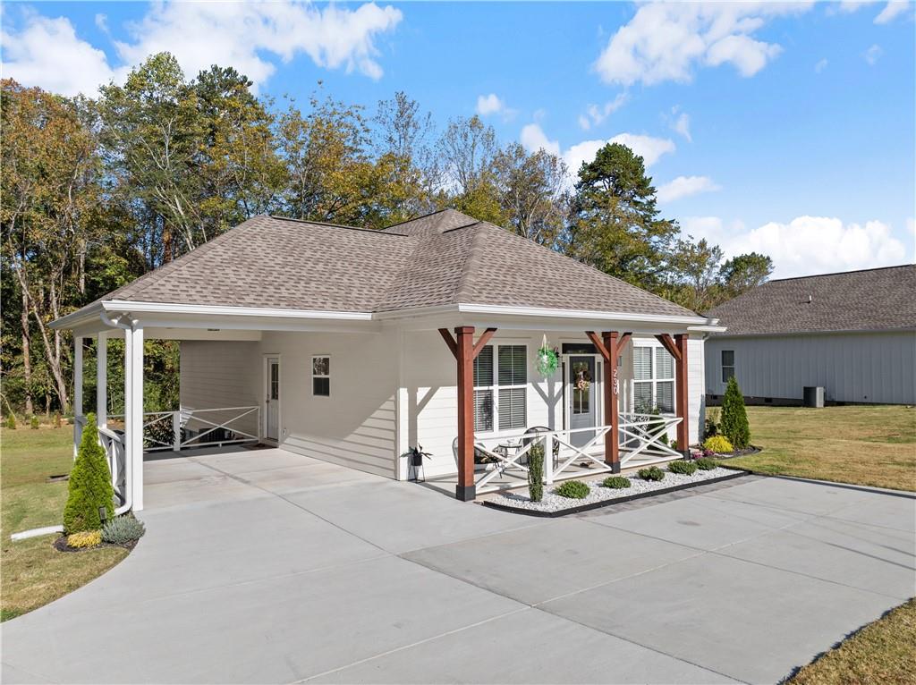 230 Campbell Street Cleveland, GA 30528 - Photo 3 of 37 a front view of a house with garden