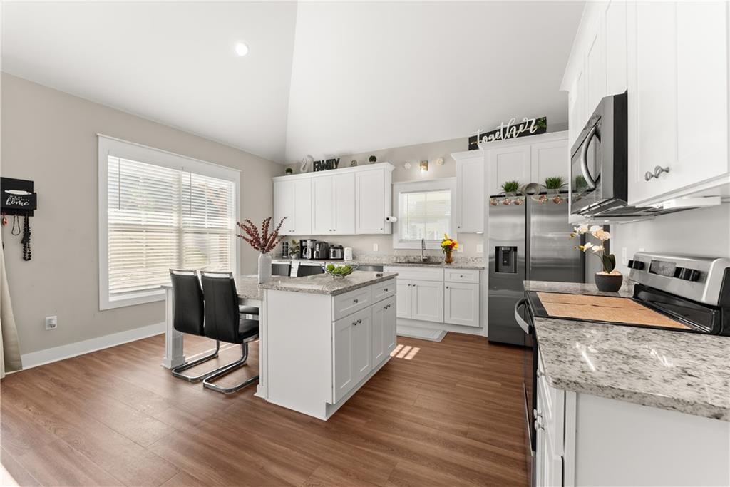 230 Campbell Street Cleveland, GA 30528 - Photo 9 of 37 a kitchen with granite countertop white cabinets and white appliances