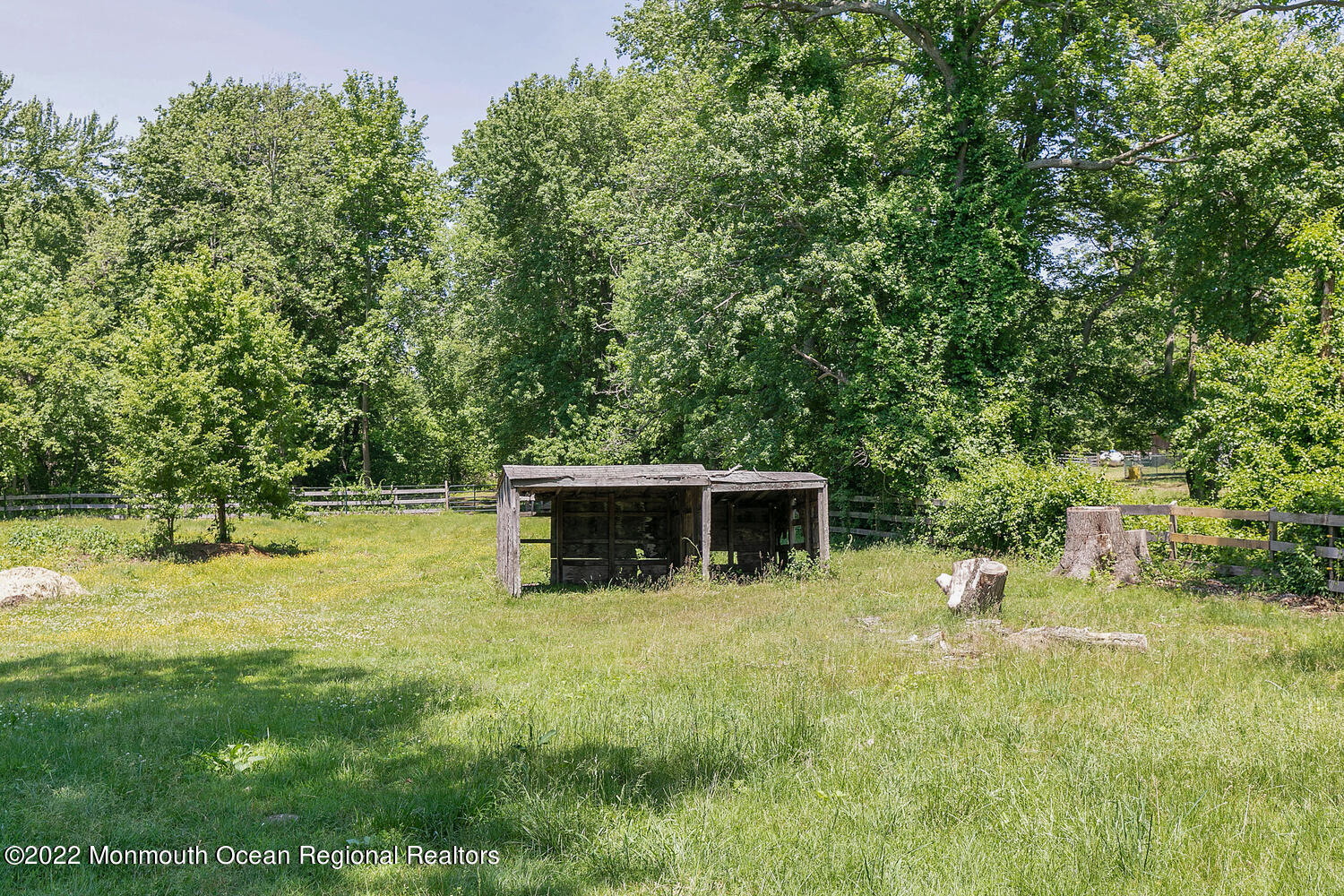 104 Peskin Road Farmingdale, NJ 07727 - Photo 11 of 54 a swimming pool with trees in the background