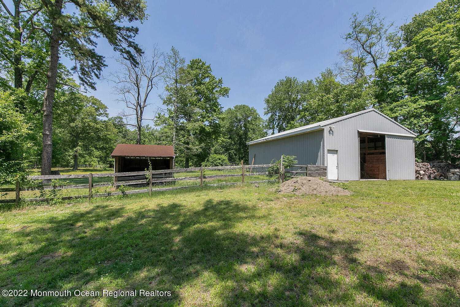 104 Peskin Road Farmingdale, NJ 07727 - Photo 14 of 54 a backyard of a house with table and chairs