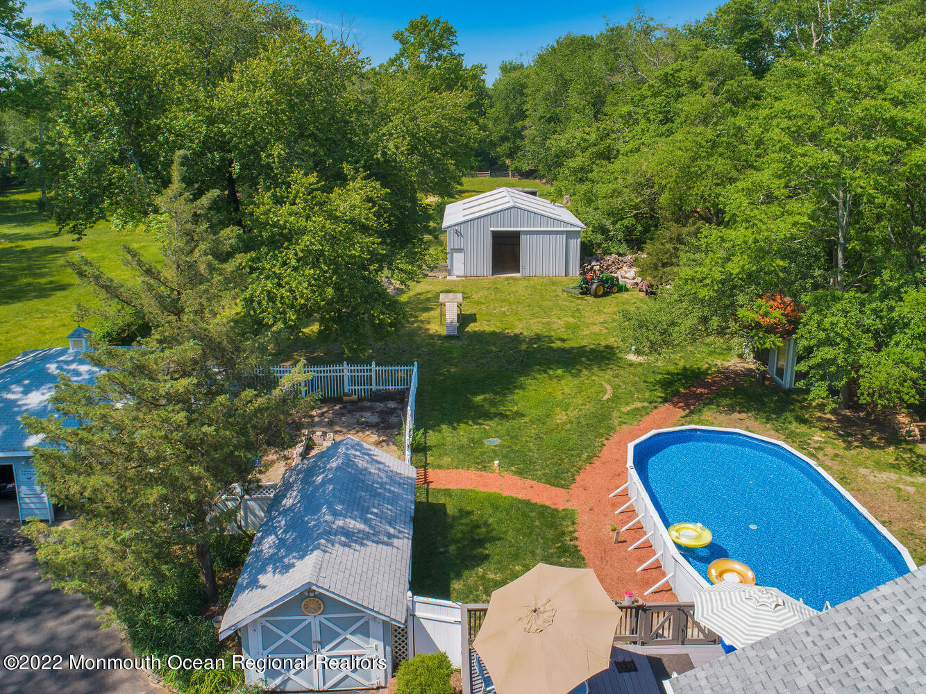 104 Peskin Road Farmingdale, NJ 07727 - Photo 16 of 54 a view of a house with a swimming pool
