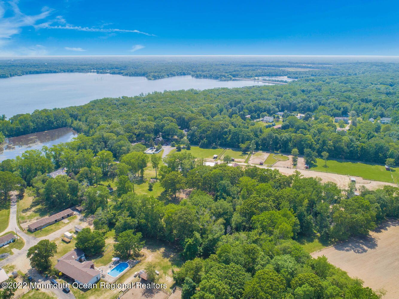104 Peskin Road Farmingdale, NJ 07727 - Photo 18 of 54 a view of a lake with a yard