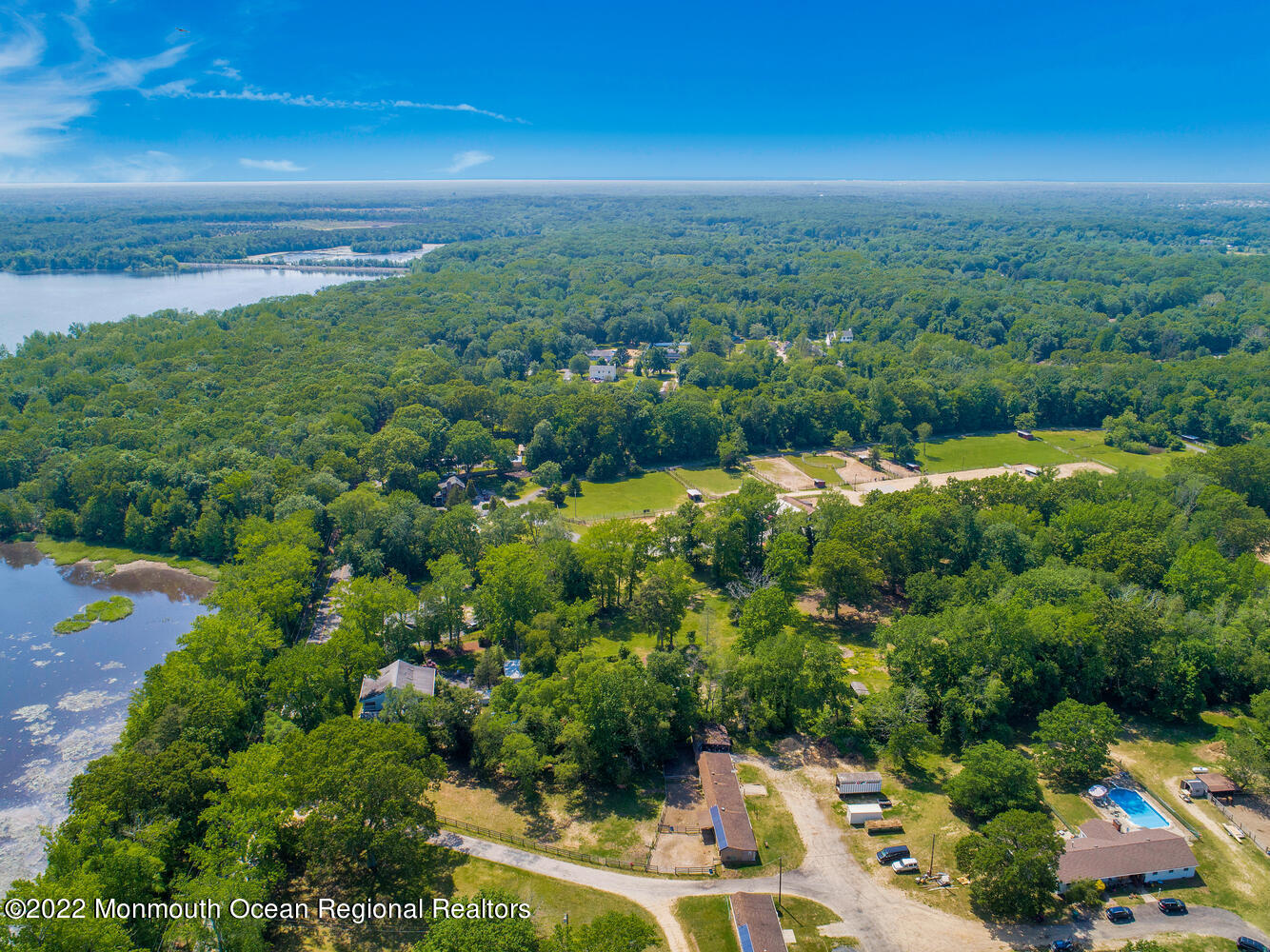 104 Peskin Road Farmingdale, NJ 07727 - Photo 19 of 54 a view of a city with lush green forest