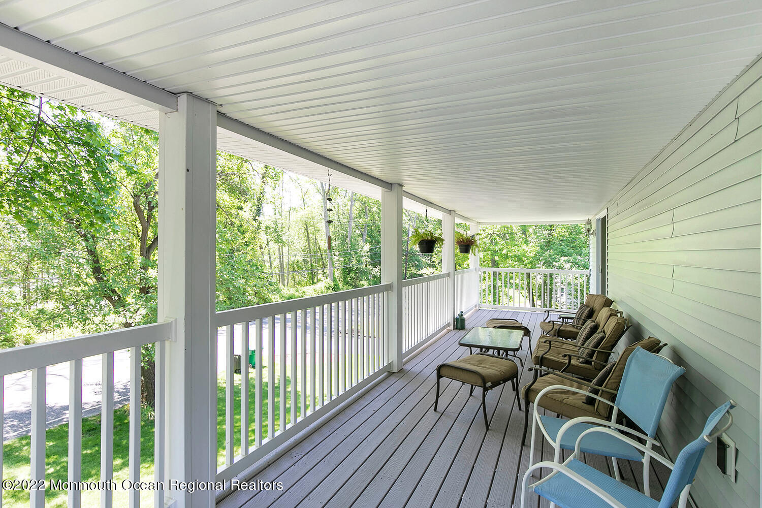 104 Peskin Road Farmingdale, NJ 07727 - Photo 28 of 54 a view of a patio with table and chairs and wooden floor