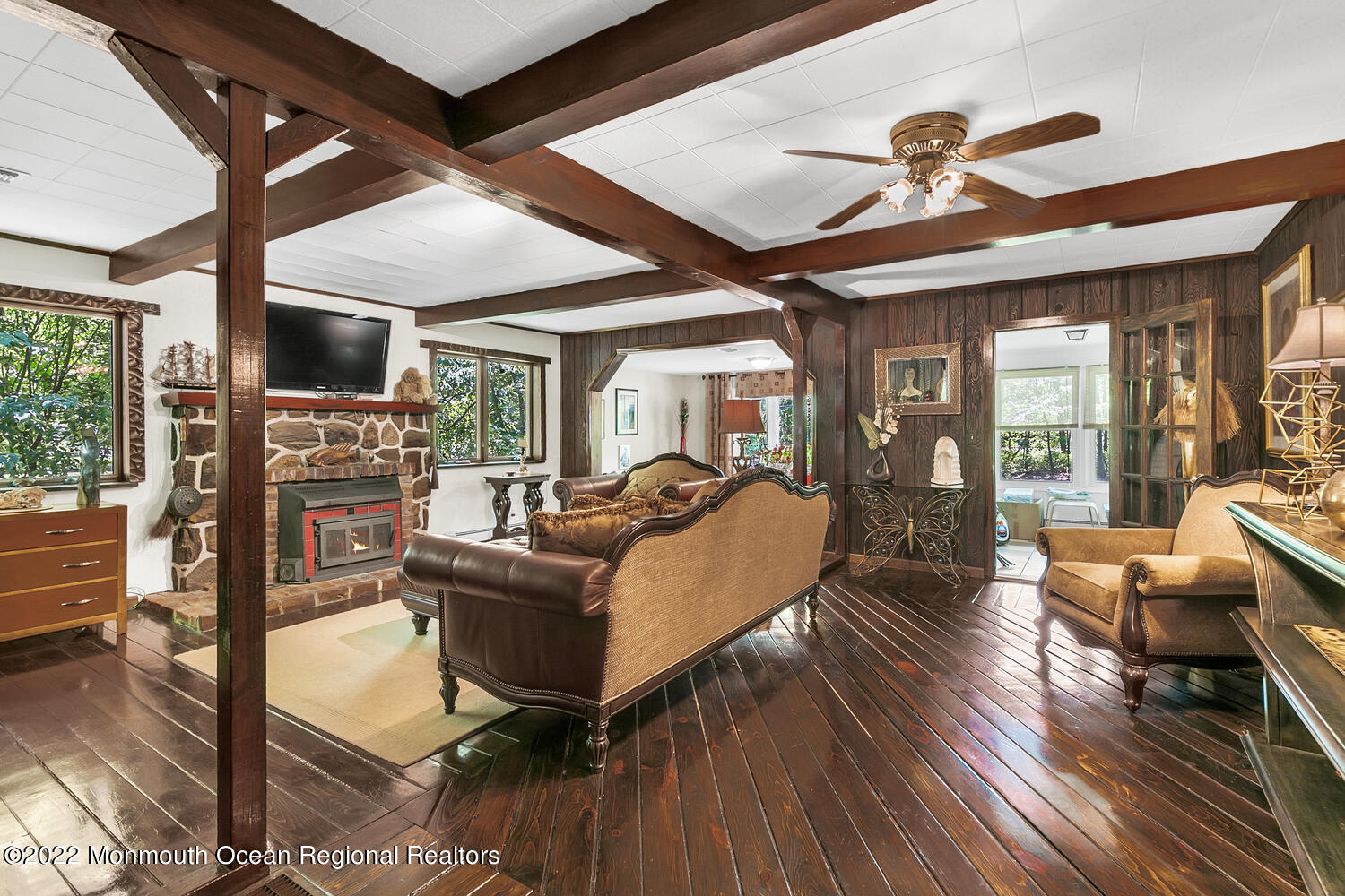 104 Peskin Road Farmingdale, NJ 07727 - Photo 35 of 54 a living room with furniture and a flat screen tv