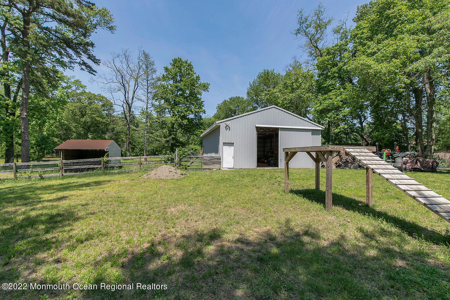 104 Peskin Road Farmingdale, NJ 07727 - Photo 7 of 54 a house with swimming pool in front of it