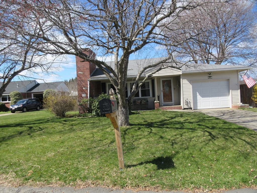 13 Sutton Place Easthampton, MA 01027 - Photo 1 of 31 a front view of a house with garden