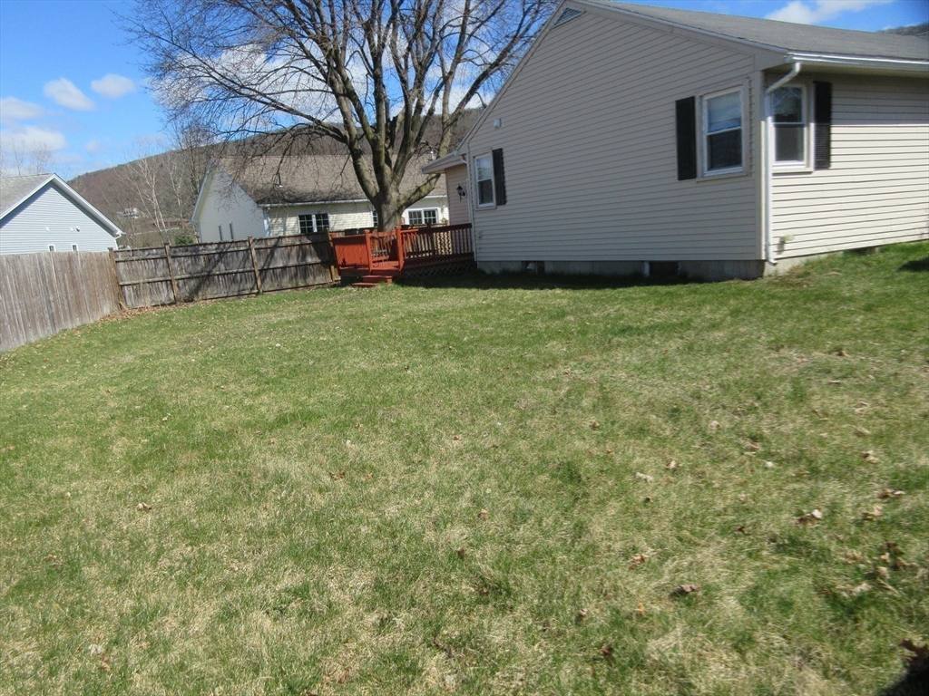13 Sutton Place Easthampton, MA 01027 - Photo 25 of 31 a view of a backyard with a large tree