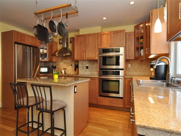 2 Ward Court Boston, MA 02127 - Photo 1 of 15 a kitchen with a sink cabinets and stainless steel appliances
