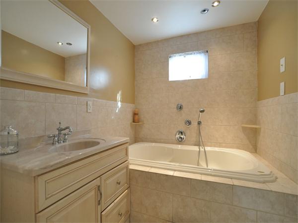 2 Ward Court Boston, MA 02127 - Photo 11 of 15 a bathroom with a tub sink and mirror
