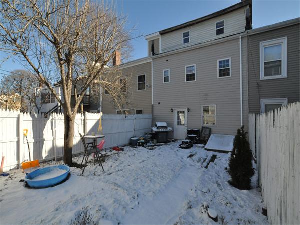 2 Ward Court Boston, MA 02127 - Photo 15 of 15 a backyard of a house with table and chairs