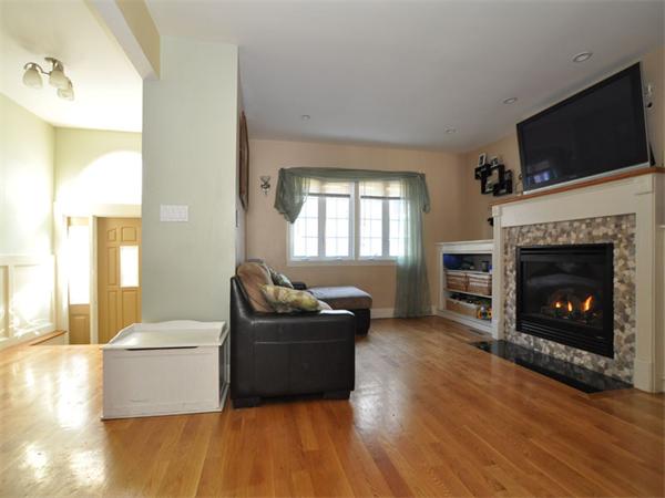 2 Ward Court Boston, MA 02127 - Photo 2 of 15 a living room with furniture and a fireplace