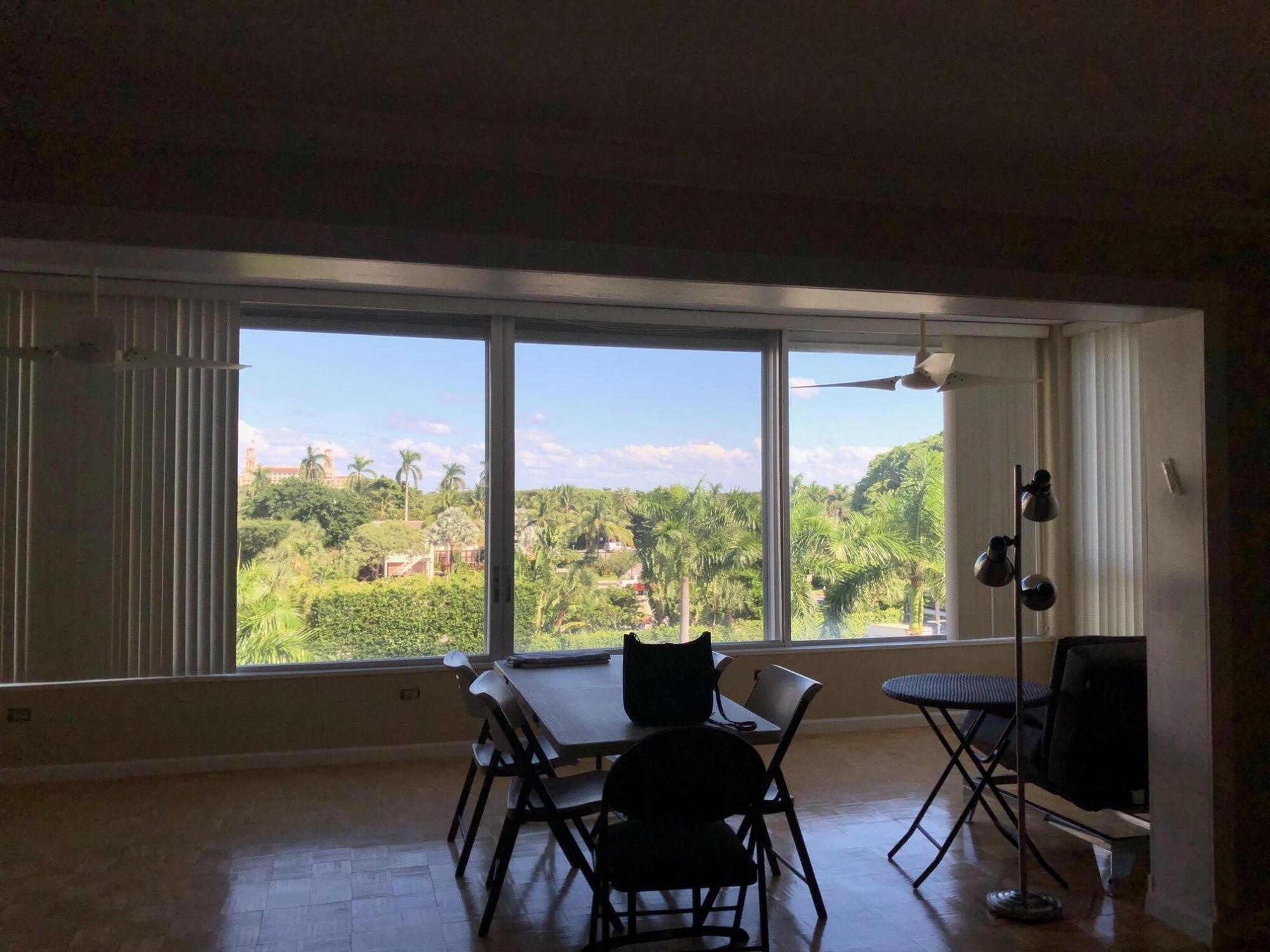 44 Cocoanut Row, Unit 323B Palm Beach, FL 33480 - Photo 4 of 4 a view of a city from a dining room with furniture and a window