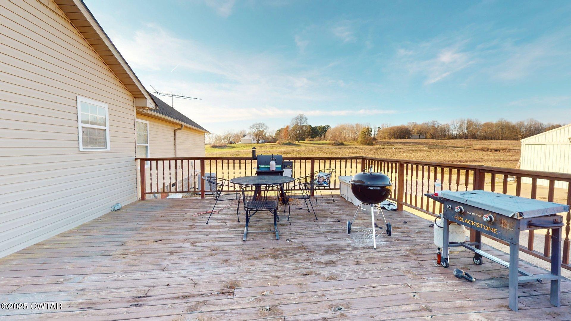 968 Cherokee Road Halls, TN 38040 - Photo 19 of 20 a view of a balcony with chairs and wooden floor